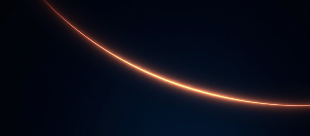 A thin warm orbital arc sweeping across a deep navy background